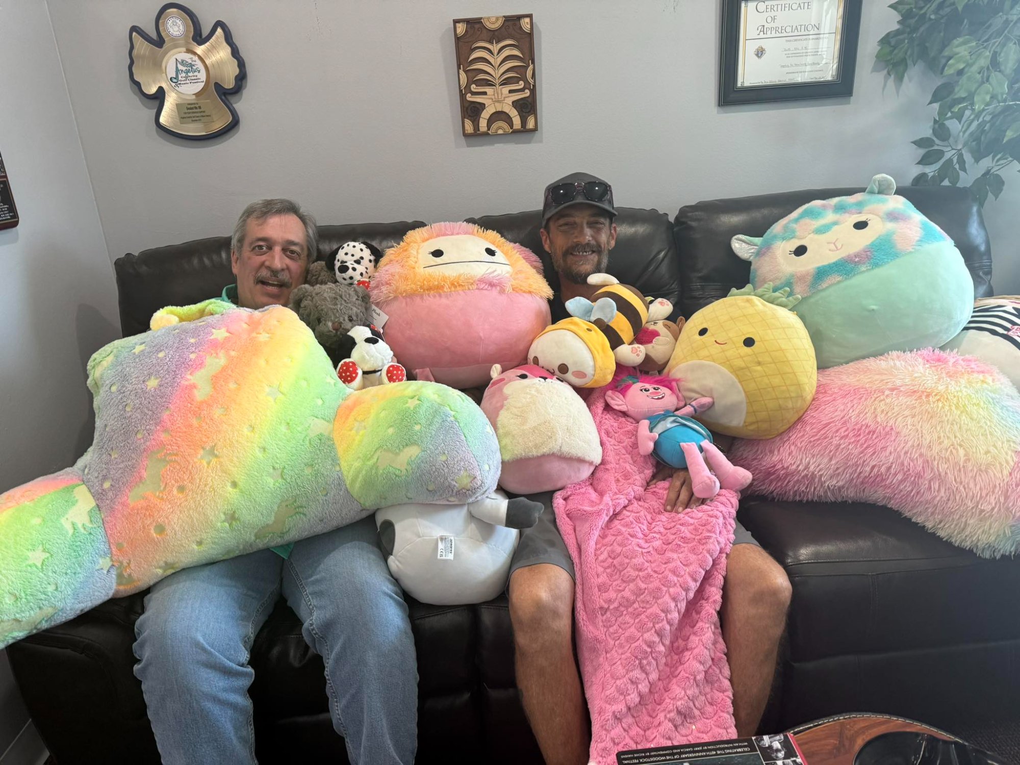 Volunteers with stuffed animal donations